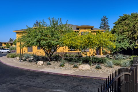 a house with a driveway and trees in front of it a house with a driveway and trees in front of it  at Polo Villas, California, 93312